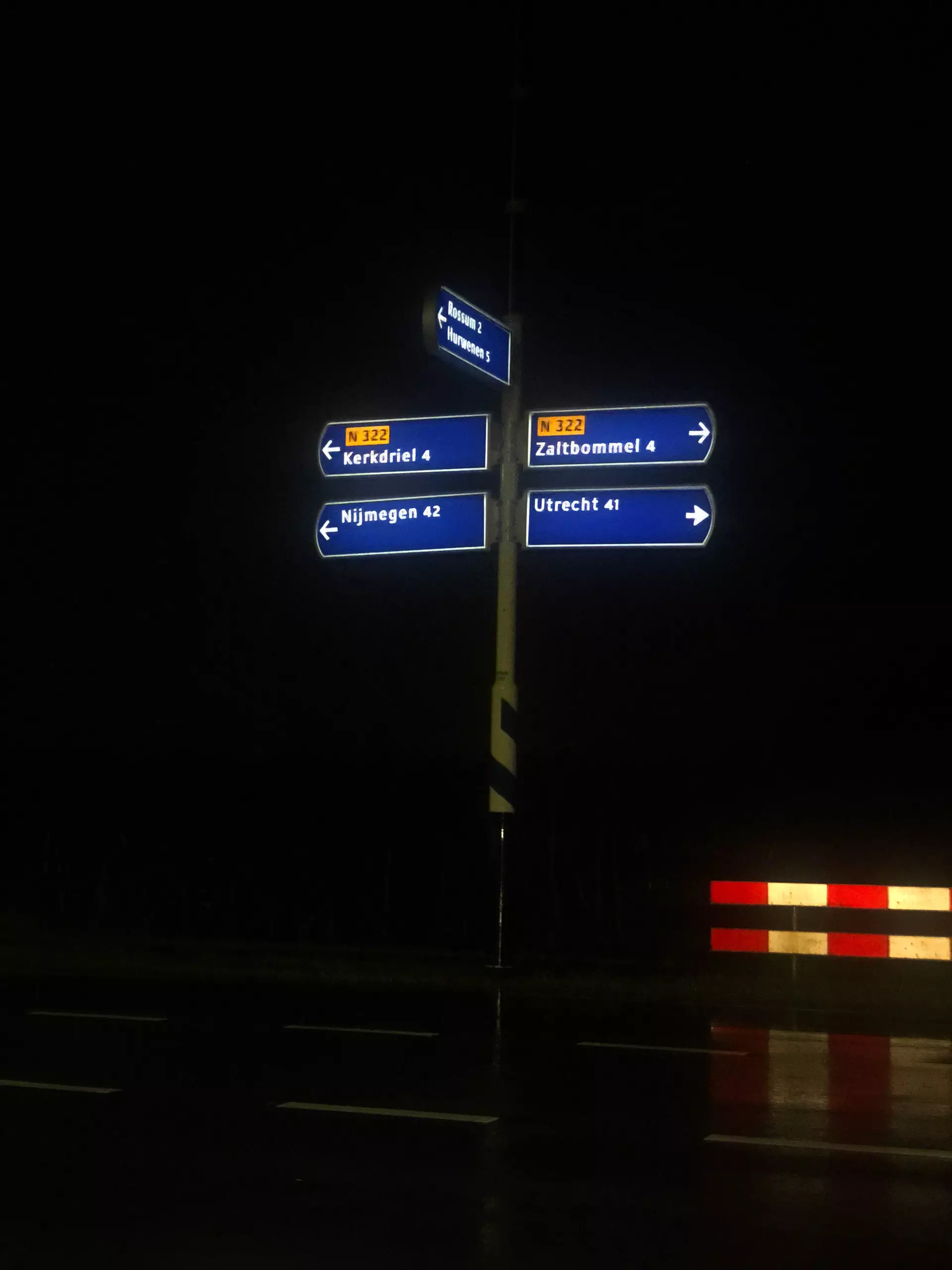 Solar illuminated road sign at night